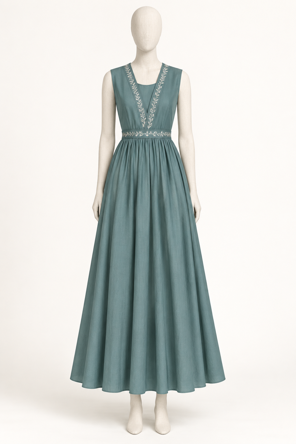 Visualisation of the teal dress as a stitched sample on a cream dress form