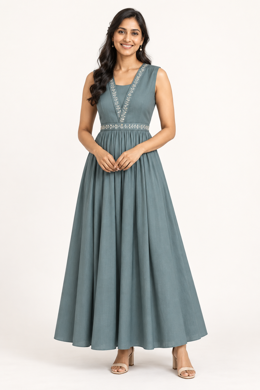 Full-length concept visual of a smiling woman wearing the teal dress with ivory floral trim